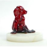 Royal Doulton Flambe model of a seated Puppy dog: Mounted on a circular marble dish, height 12.5cm.