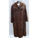 An Ermine fur ladies Coat: Size 16, full length.