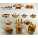 A collection of Shelley items to include: Preserve pots, egg cups and stand, lemon juicers,