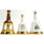 A collection of Wade Whisky Bells / Decanters: Sealed with contents.