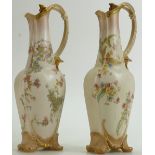 Doulton Burslem pair of Spanishware Ewers: Gilded and decorated with flowers, height 26cm.