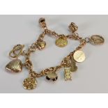 9ct gold charm bracelet: with 13 charms, 30.1 grams.