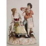 Dresden style porcelain figure group: of a lady with goat & gentleman playing flute, height 16.5cm.