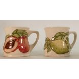 Moorcroft Mugs: Decorated with peaches and limes.