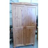 Pine two door wardrobe: with shelving cupboard.