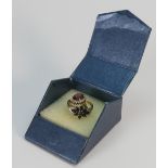 9ct gold ladies dress rings: one set with garnet & diamonds and the other blue stones,