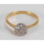 18ct 7 stone diamond ring: size L, 2 grams.