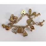 9ct gold charm bracelet: with 14 9ct gold charms, 43.9 grams.