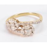 18ct gold & diamond cluster ring: a combination of baguette, Marquise & round diamonds.