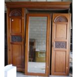 Large Edwardian Walnut Triple wardrobe: with carved decoration