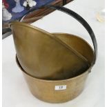 A large heavy brass jam pan: together with large similar scale pan (2)