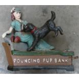 Reproduction cast iron Pouncing Pup moneybank: length 22cm.