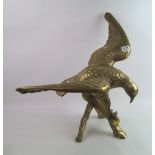 A large brass eagle: on a branch. Height 50.5cm