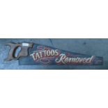 Old advertising saw with "tattoos removed" :painted on the blade, length 66cm.