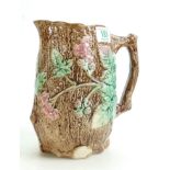 Continental Type Majolica Jug: with leaf and berry embossed decoration, height 22cm