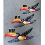 Reproduction set of cast iron flying toucans: largest length 26cm.(3)