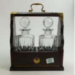 A wooden Tantalus: complete with Bohemia crystal decanters