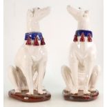 Pair of mid 20th century Majolica pottery large seated Dogs: Height 36cm. (2)