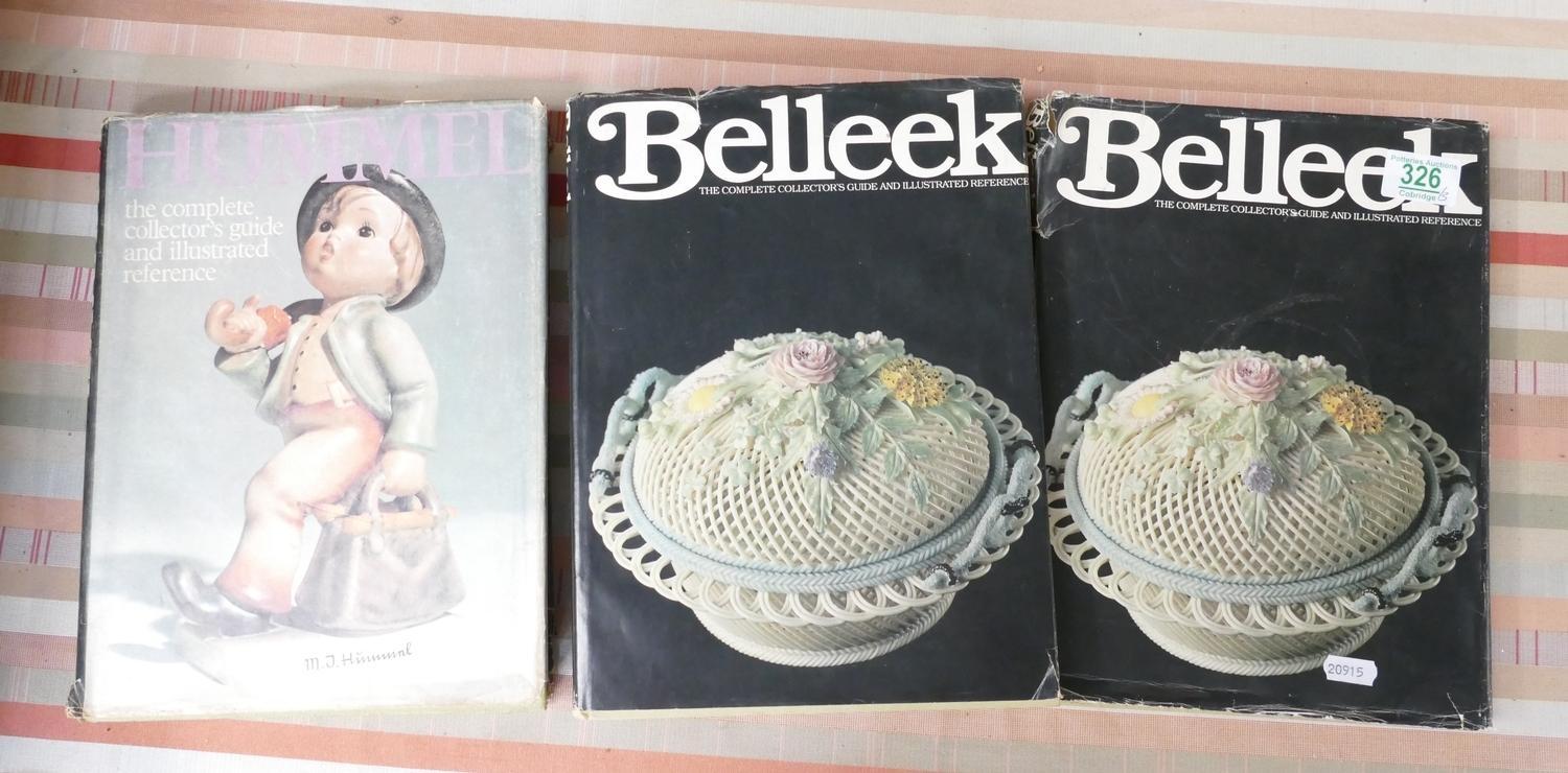 Two Belleek refernce books: together with a Hummel book and a hand painted wooden plaque with a