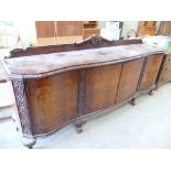 Large 1920's Burr Walnut Shaped 4 Door Sideboard: fitted interior on ball & claw feet, width 239cm,