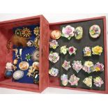 A collection of Floral decorated brooches and similar costume jewelry