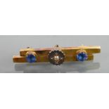 Victorian yellow metal double bar brooch set with semi precious stones: tested as higher than 9ct