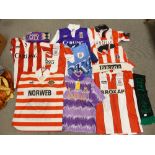 A collection of Stoke City 1990's football shirts: home and away strips together with scarfs and a
