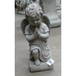 Garden Ornament in the form of a praying cherub,