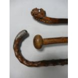Three Carved Walking Sticks: including oriental inspired item,