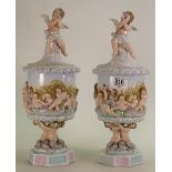 Pair Continental Lidded Urns decorated with cherubs height 36cm: