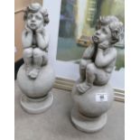 Garden Ornament in the form of 2 cherubs sat on ball ,