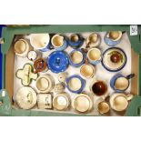 A collection of Torquay and similar ware to include: match holders, condiment sets,
