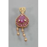 9ct gold ornate pendant: 3.9 grams, set with heart shaped and small semi precious stones.