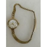 9ct gold Tissot ladies watch: Ticking order, bracelet plated.