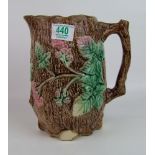 Continental Type Majolica Jug: with leaf and berry embossed decoration, height 22cm