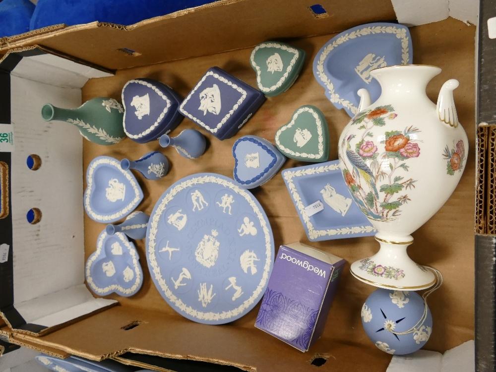 A collection of Wedgwood jasperware including various colour trinket boxes, miniature vases, two