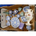 A collection of Wedgwood jasperware including various colour trinket boxes, miniature vases, two