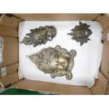 A collection of Indian gods metal wall plates: