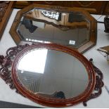 Oak framed bevel edged mirror: and similar later item