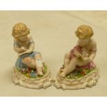 A pair of Continental style ceramic figures: of children reading (2)