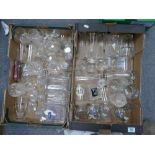 A large collection of glass items: to include decanters, branded glassware etc (2 trays)