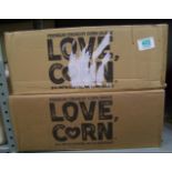 A quantity of Love Corn: premium corn snacks approx 400 packs.