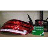 A car wing mirror, Mercedes rear light and Lucas bulbs.