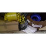 A collection of hoses, cable, brushes etc.