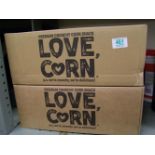 A quantity of Love Corn: premium crunchy corn snacks, approx 400 packs.