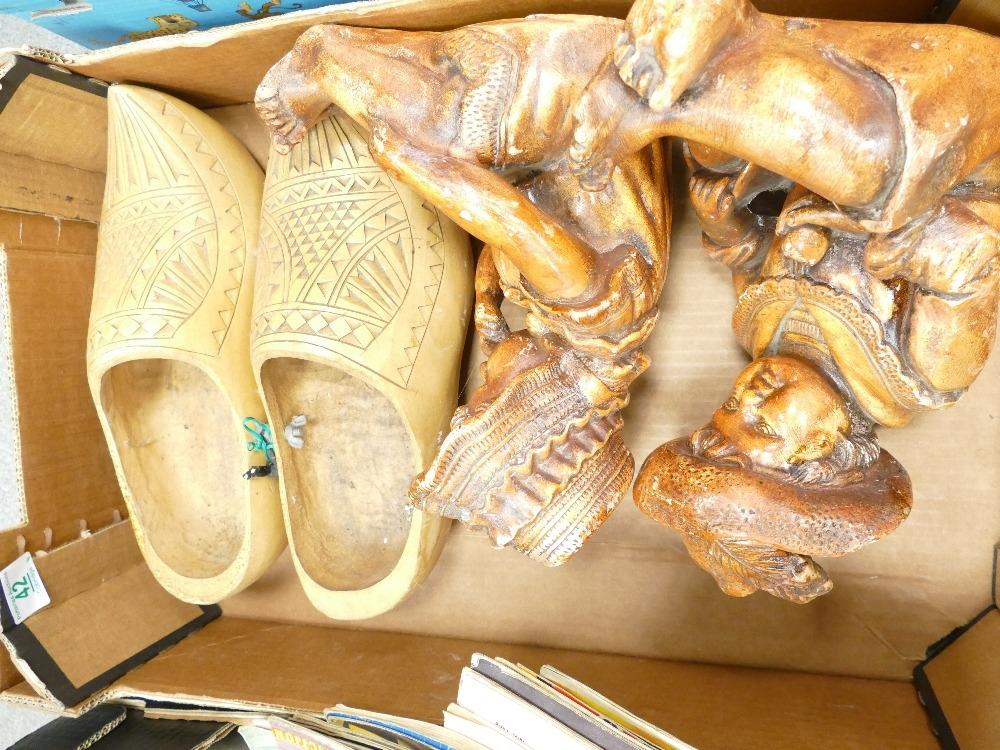 A mixed collection of items to include large dutch wooden clogs: and similar plaster figures