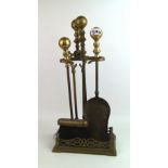 A brass fireside companion set 51 cm in height: