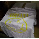 A quantity of white and yellow Nirvana tshirts: XL.