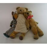 A collection of soft toys to include: growler bear, baby bear and an Arabian style doll (3)