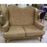 Two seater wing backed fabric settee: